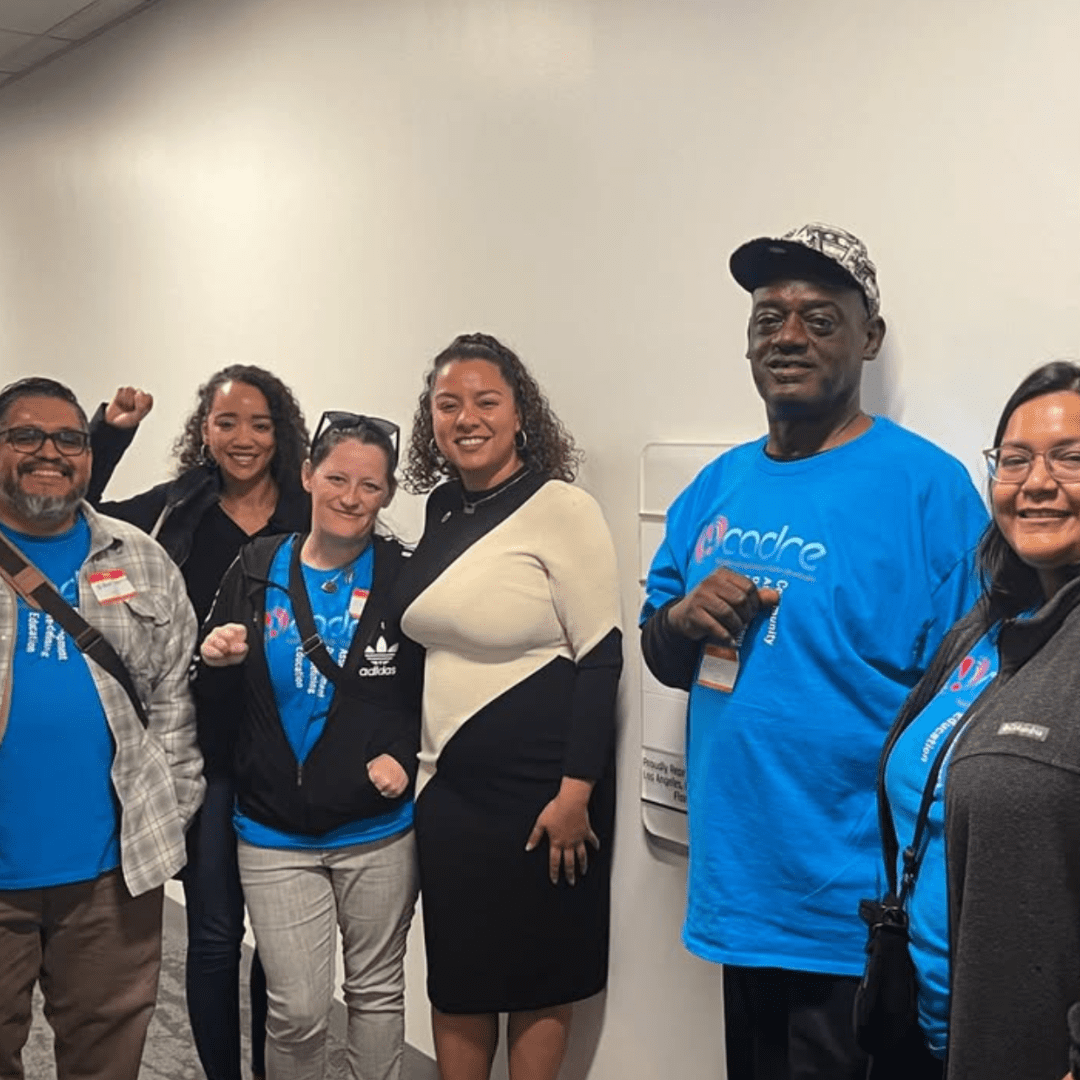Group of people in blue shirts.