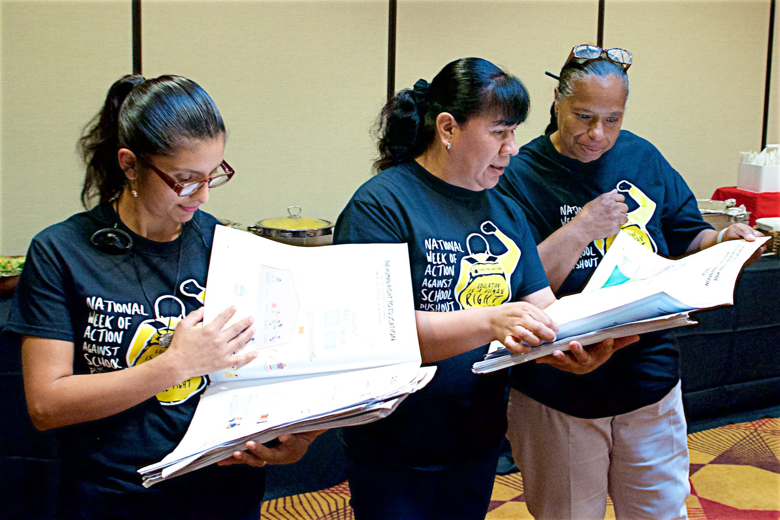 CADRE parents reviewing campaign and training materials together